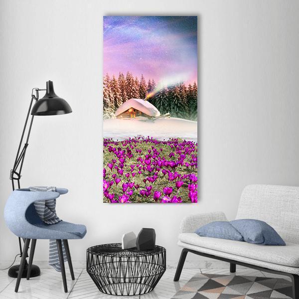 Snowy Cabin Among Purple Crocuses Vertical Canvas Wall Art in white, purple and pink, single vertical panel hung on a wall