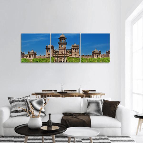 University of Peshawar Clock Tower and Domes Panoramic Canvas Wall Art in brown, green and blue, hung on a wall