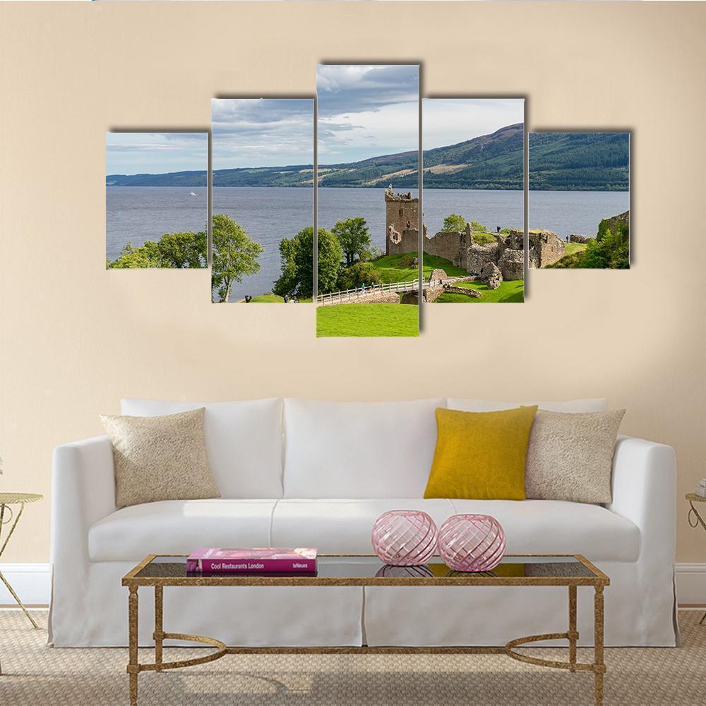 Urquhart Castle Ruins by the Lake Canvas Wall Art in gray, green and blue, 5 panel Star layout hung on a wall