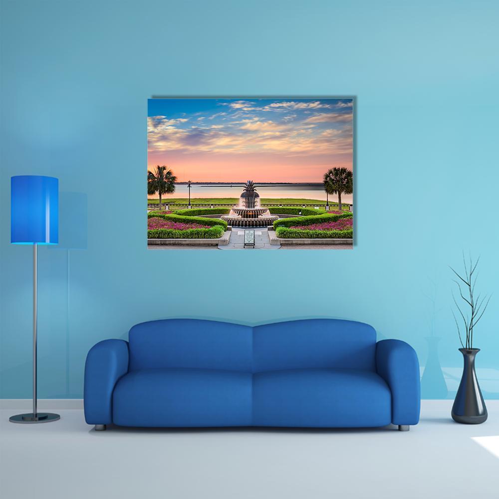 Waterfront Park Fountain at Sunset Canvas Wall Art in orange, blue and pink, single panel hung on a wall