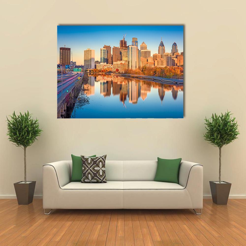 Philadelphia Schuylkill River Skyline at Golden Hour Canvas Wall Art in gold, orange and blue, single panel hung on a wall