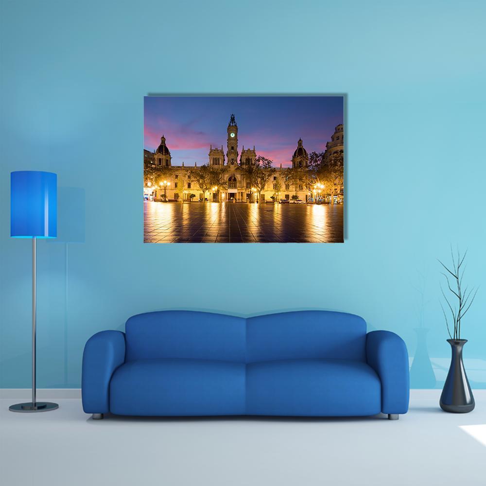Valencia City Hall at Twilight Canvas Wall Art in yellow, blue and purple, single panel hung on a wall