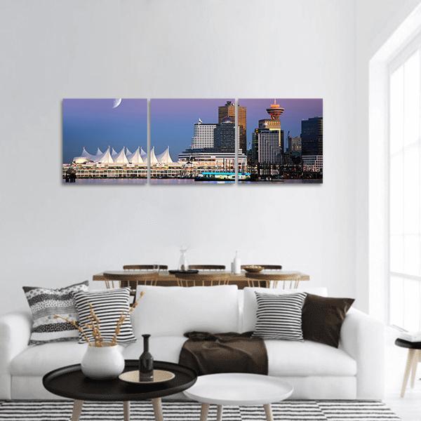 Vancouver City Skyline at Dusk Panoramic Canvas Wall Art in blue and purple, hung on a wall