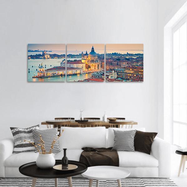 Santa Maria Della Salute at Dusk, Venice Panoramic Canvas Wall Art in orange, yellow and blue, hung on a wall