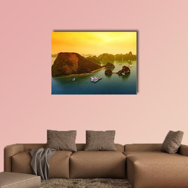 Halong Bay Sunset Over Limestone Islands Canvas Wall Art in orange, yellow and blue, single panel hung on a wall