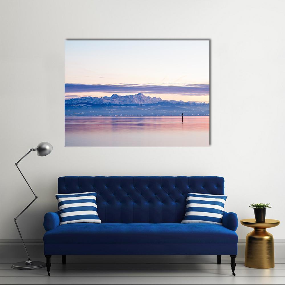 Lake Constance View of Swiss Alps Canvas Wall Art in white, blue and pink, single panel hung on a wall