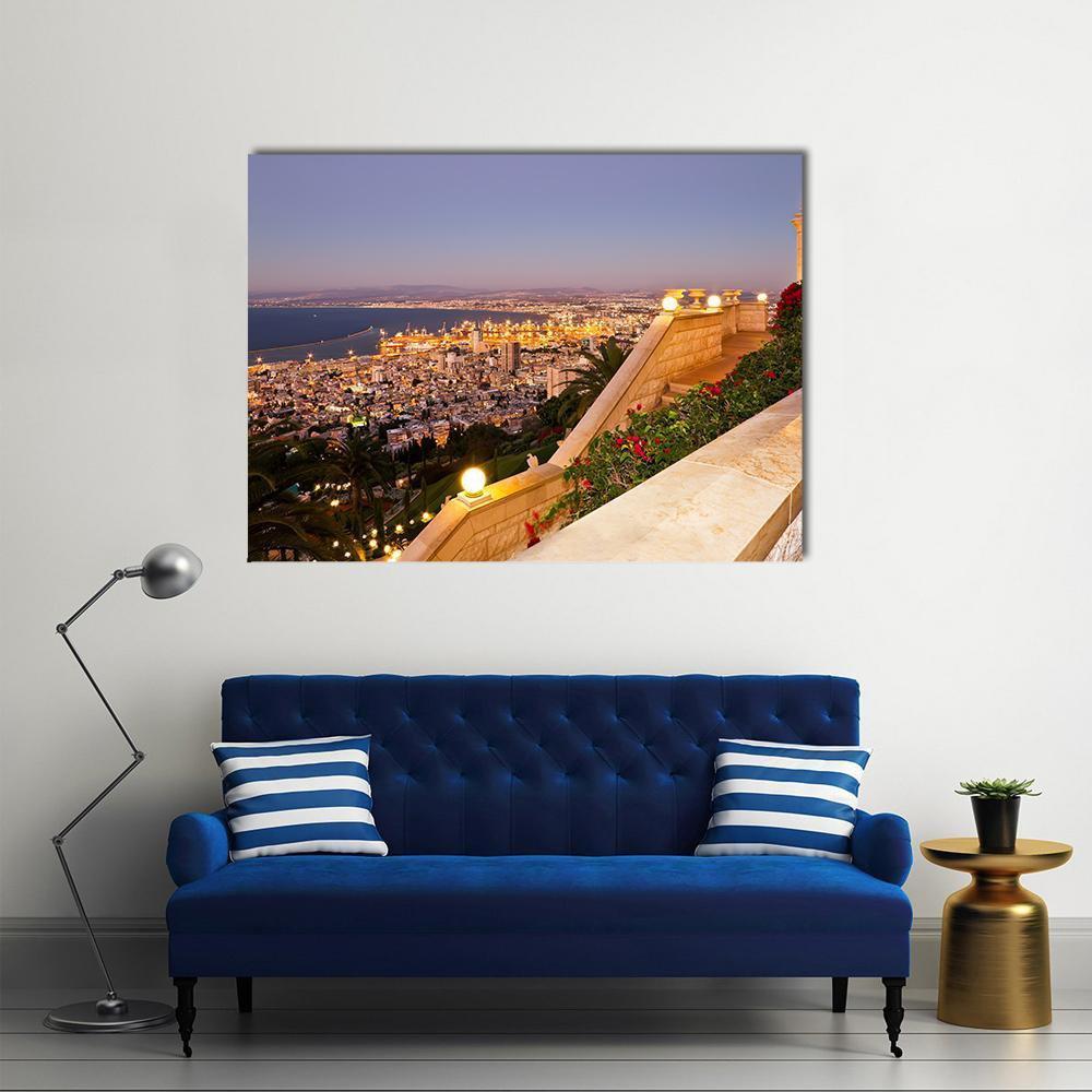 Coastal City at Dusk with Staircase Canvas Wall Art in beige, yellow and blue, single panel hung on a wall