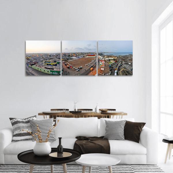 Accra Cityscape with Ocean Horizon Panoramic Canvas Wall Art in gray, brown and blue, hung on a wall