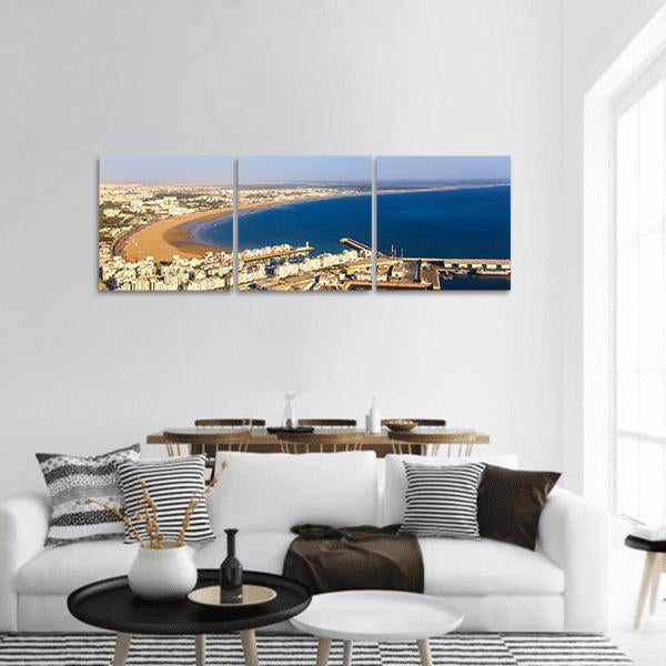 Agadir Coastal Cityscape Panoramic Canvas Wall Art in white, beige and blue, hung on a wall