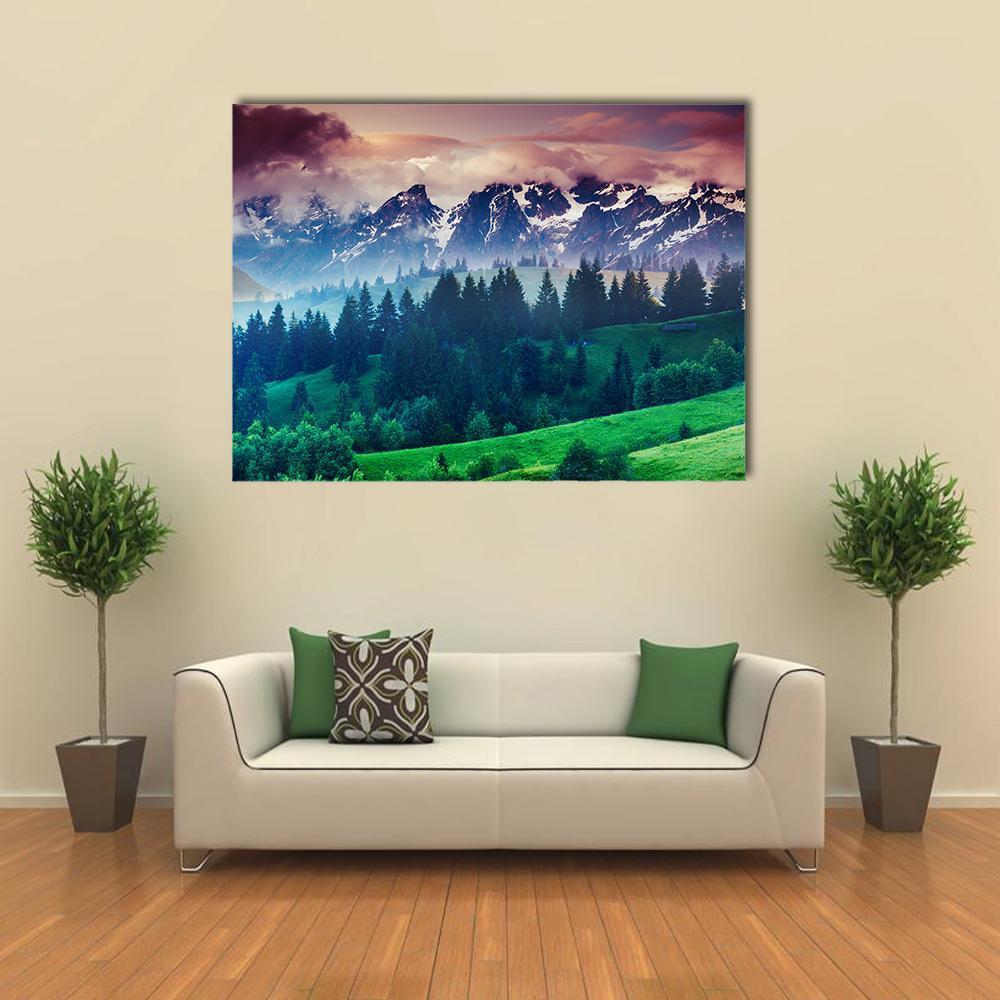 Alpine Meadows with Snow-capped Peaks Canvas Wall Art in green, blue and purple, single panel hung on a wall