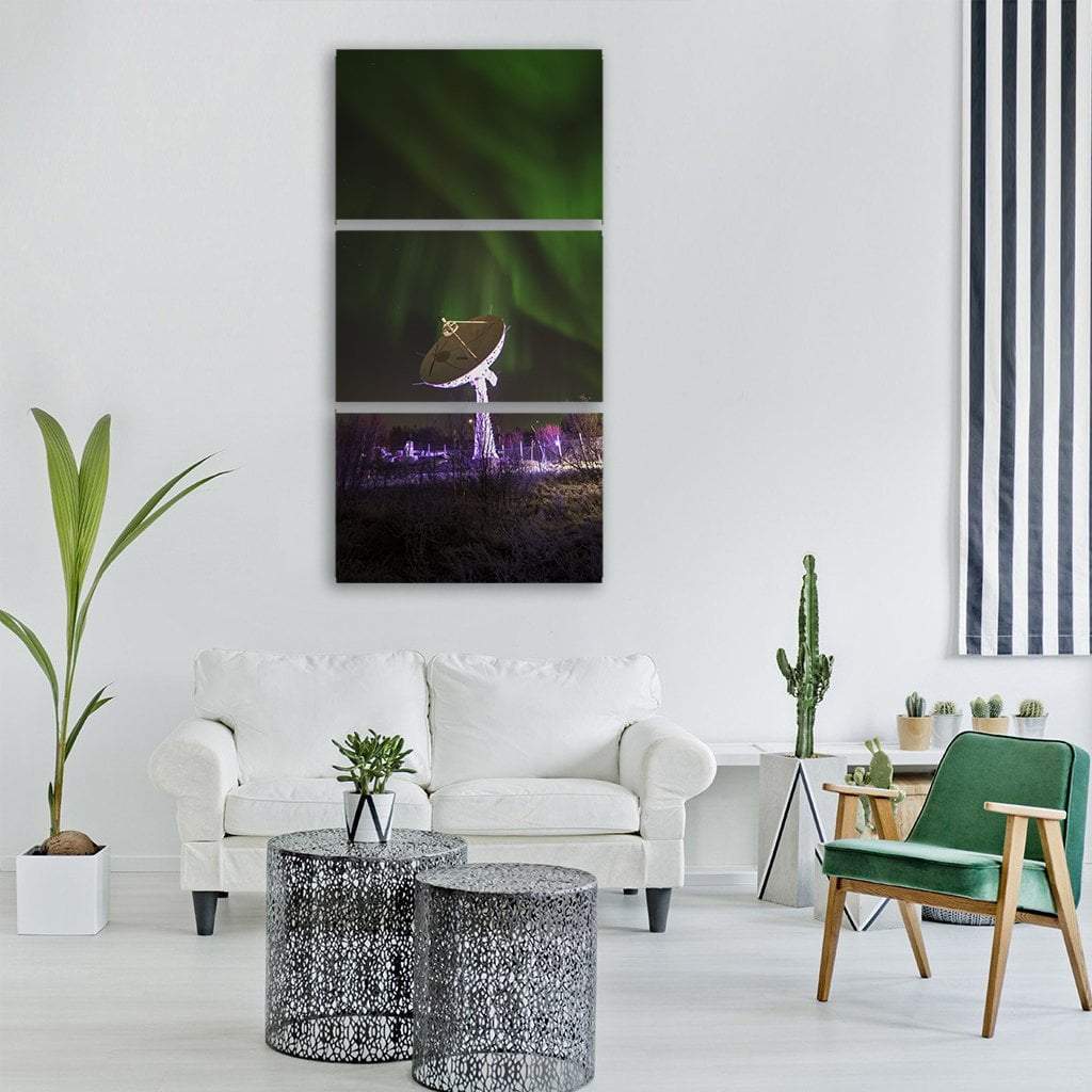 Satellite Dish Under Northern Lights Vertical Canvas Wall Art in black, green and purple, single vertical panel hung on a wall