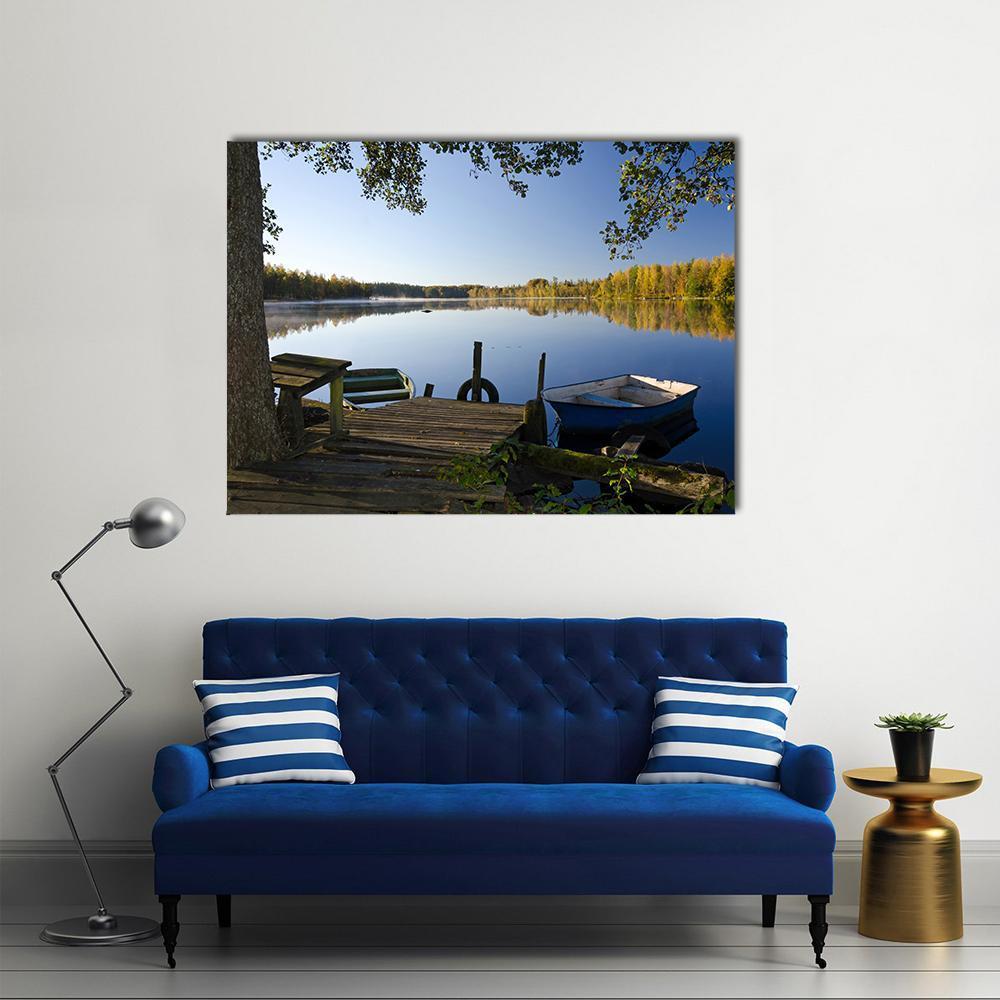 Autumn Lake with Wooden Dock Canvas Wall Art in brown, yellow and blue, single panel hung on a wall