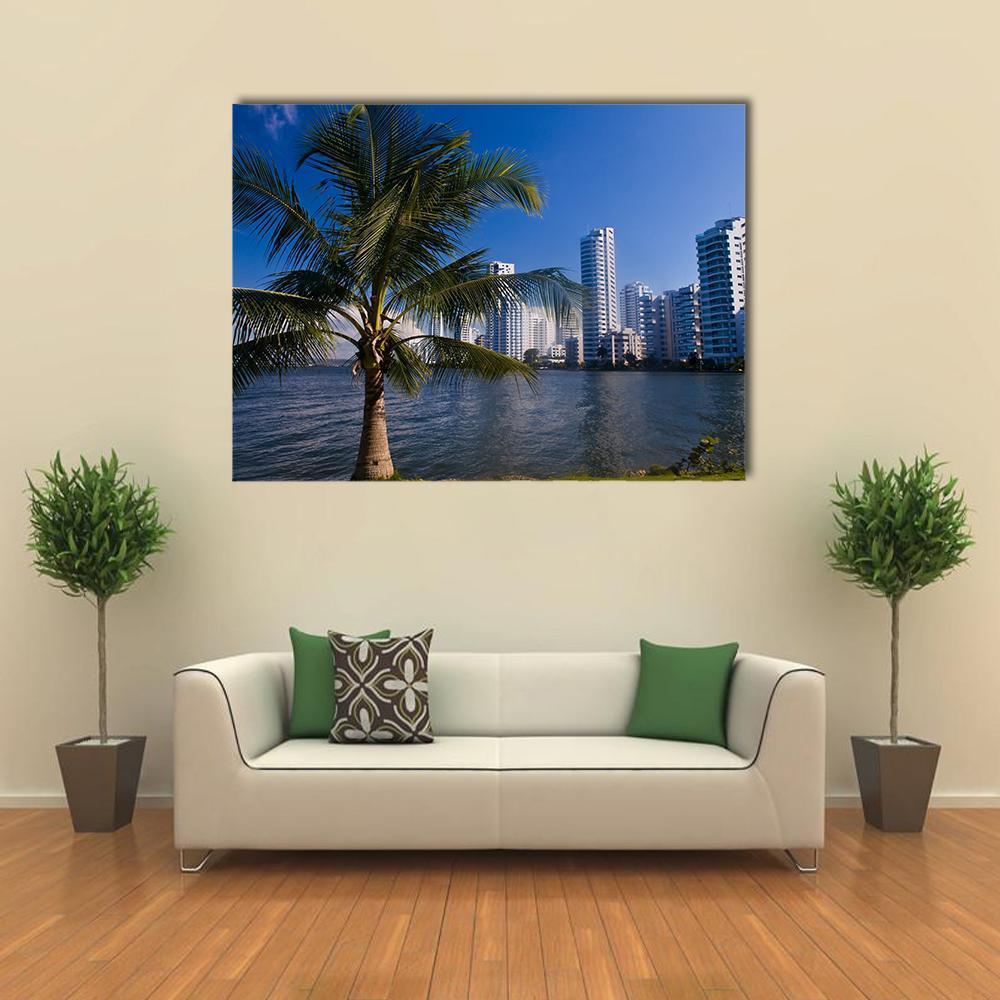 Boca Grande Cartagena Tropical Skyline Canvas Wall Art in white, green and blue, single panel hung on a wall