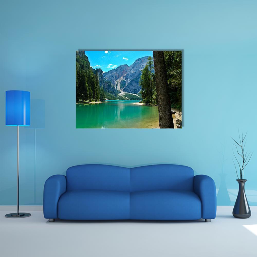 Turquoise Lake with Rocky Mountain Peaks Canvas Wall Art in gray, green and blue, single panel hung on a wall