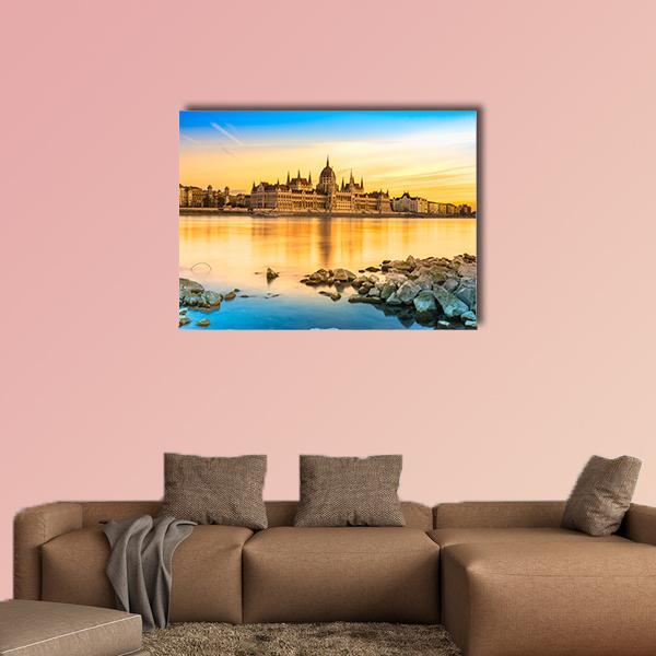 Budapest Parliament at Sunset Canvas Wall Art in orange, yellow and blue, single panel hung on a wall