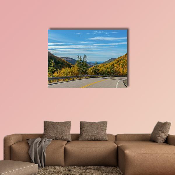 Cabot Trail Mountain Road View Canvas Wall Art in yellow, green and blue, single panel hung on a wall