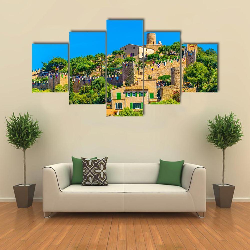 Hilltop Castle and Village Canvas Wall Art in brown, green and blue, 5 panel Star layout hung on a wall
