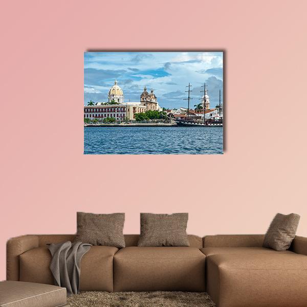 Cartagena Harbor with Domed Buildings and Tall Ship Canvas Wall Art in white, beige and blue, single panel hung on a wall