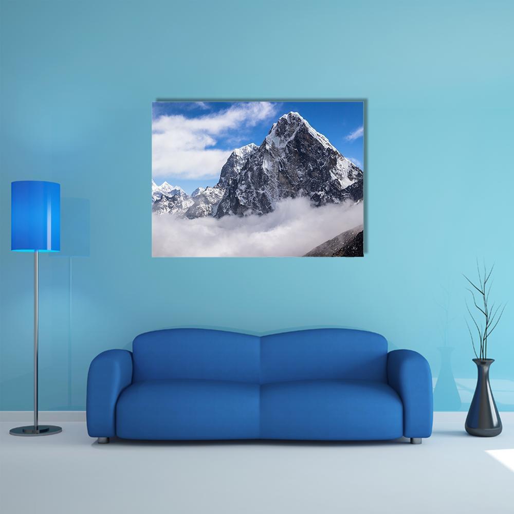 View of Cholatse Peak Canvas Wall Art in white, gray and blue, single panel hung on a wall