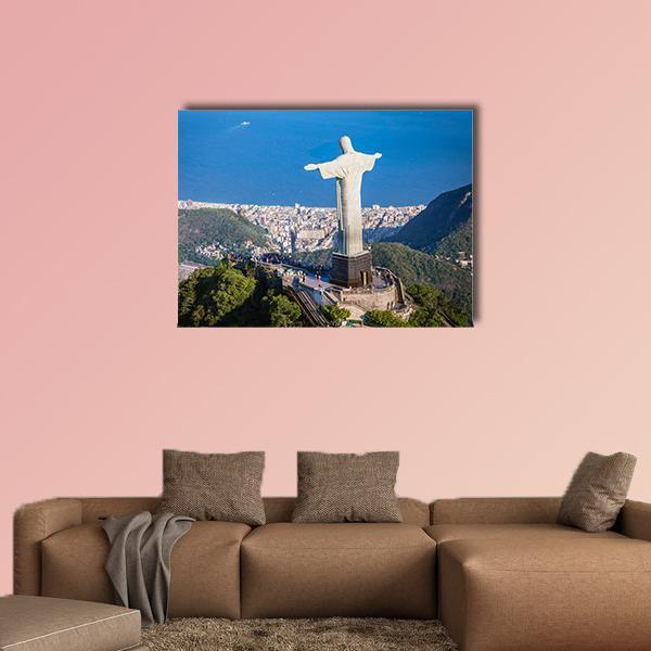 Christ the Redeemer Over Guanabara Bay Canvas Wall Art in white, green and blue, single panel hung on a wall