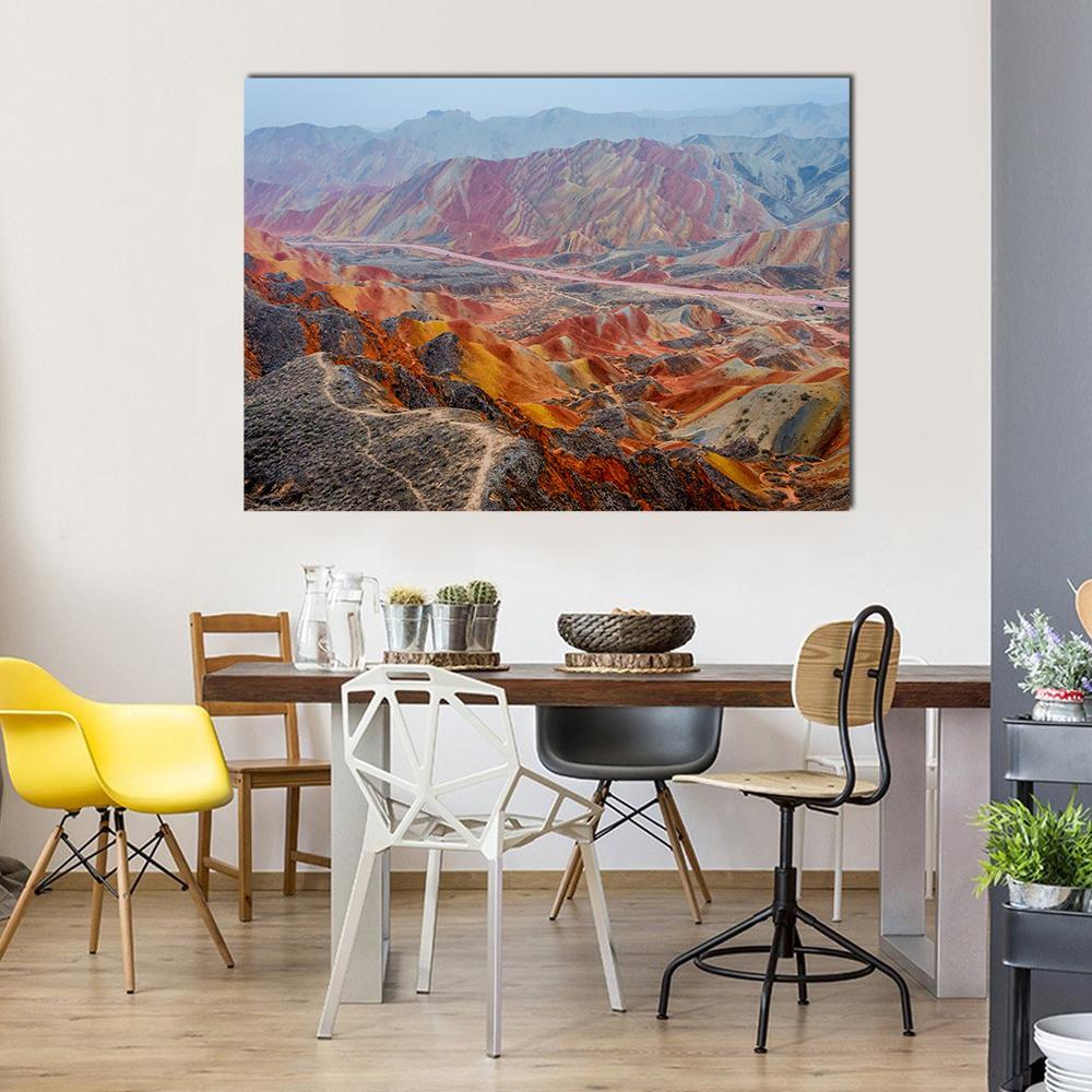 Colorful Rainbow Mountains in China Canvas Wall Art in red, orange and multicolor, single panel hung on a wall