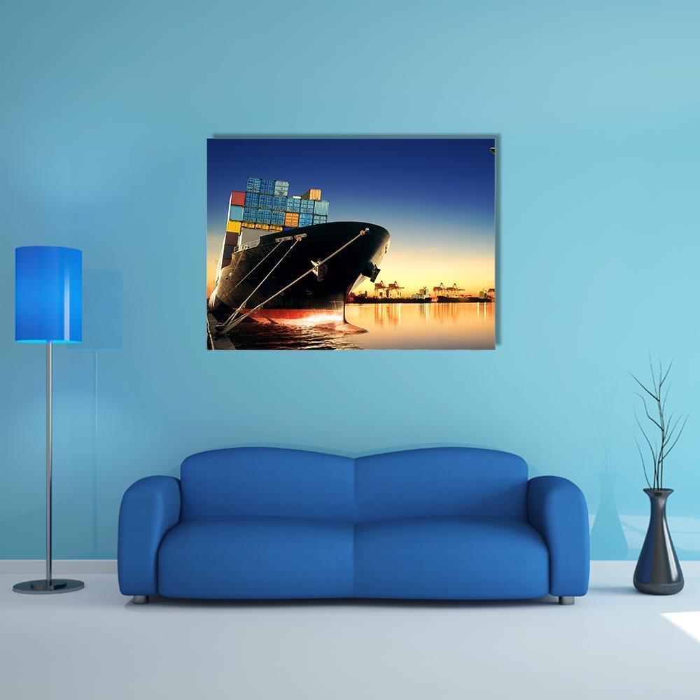 Container Ship in Harbor at Sunset Canvas Wall Art in orange, yellow and blue, single panel hung on a wall