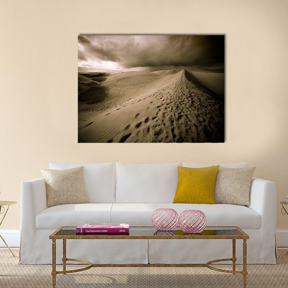 Desert Dune Footprints Under Night Sky Canvas Wall Art in black, beige and brown, single panel hung on a wall