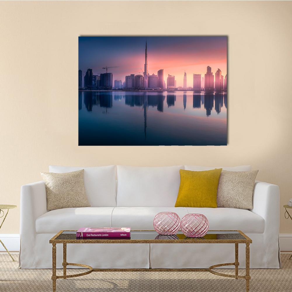 Dubai Business Bay Skyline at Sunset Canvas Wall Art in orange, blue and pink, single panel hung on a wall