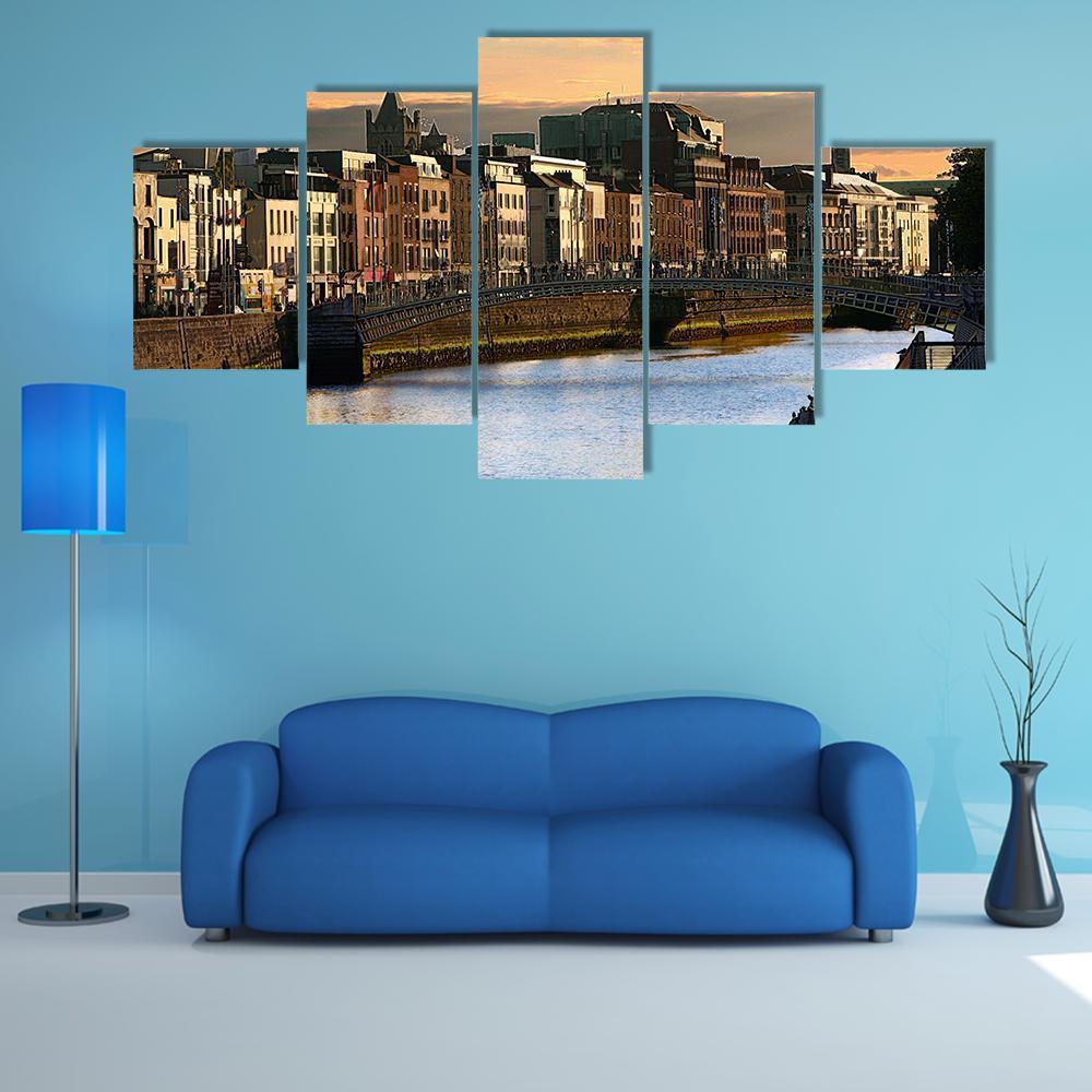 River Liffey at Sunset, Dublin Canvas Wall Art in orange, yellow and blue, 5 panel Star layout hung on a wall