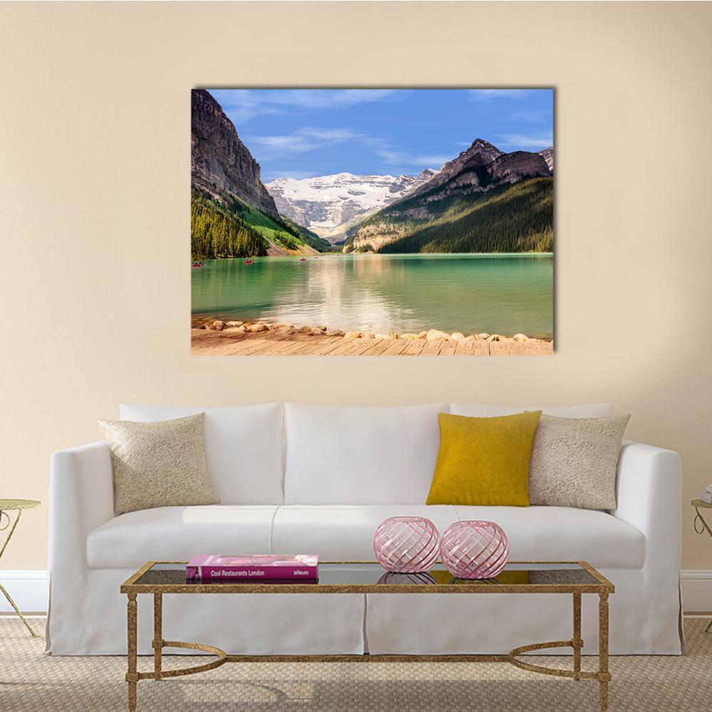 Emerald Lake with Snow-capped Mountains Canvas Wall Art in brown, green and blue, single panel hung on a wall