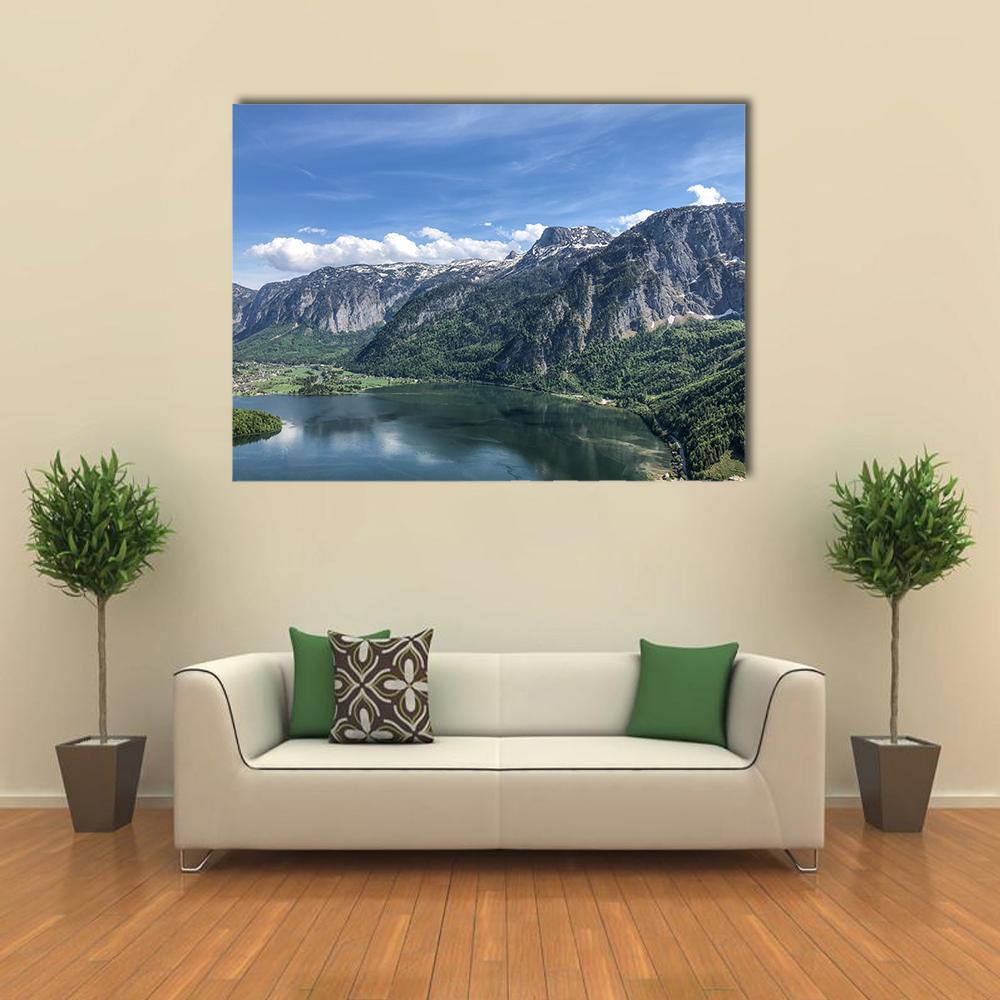 Alpine Lake and Mountain Village Canvas Wall Art in gray, green and blue, single panel hung on a wall