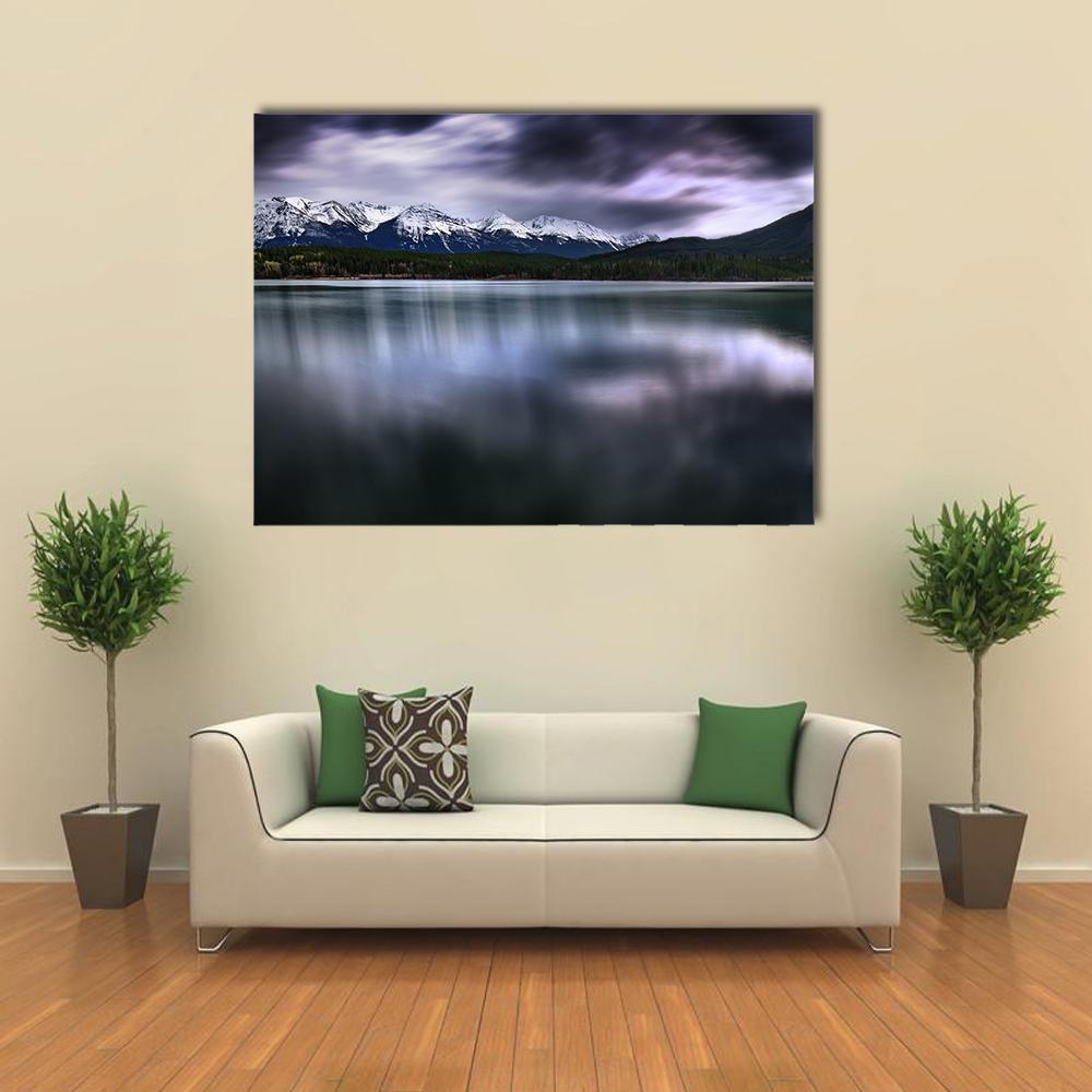 Forest and Mountain Lake View Canvas Wall Art in gray, blue and purple, single panel hung on a wall