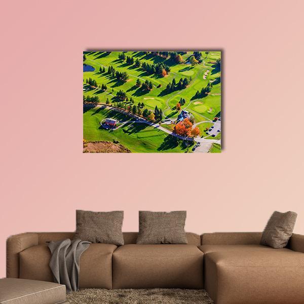 Aerial View of Golf Course in Fall Canvas Wall Art in orange, yellow and green, single panel hung on a wall