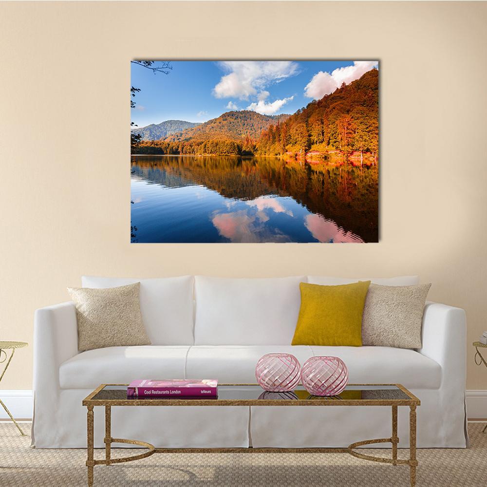 View of Karagol Black Lake Canvas Wall Art in brown, orange and blue, single panel hung on a wall