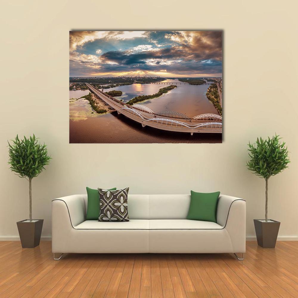 Kiev Bridge at Sunset Canvas Wall Art in brown, orange and blue, single panel hung on a wall