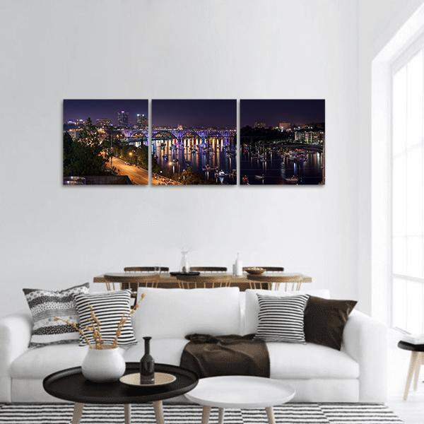 Knoxville Night Skyline Panoramic Canvas Wall Art in black, blue and purple, hung on a wall