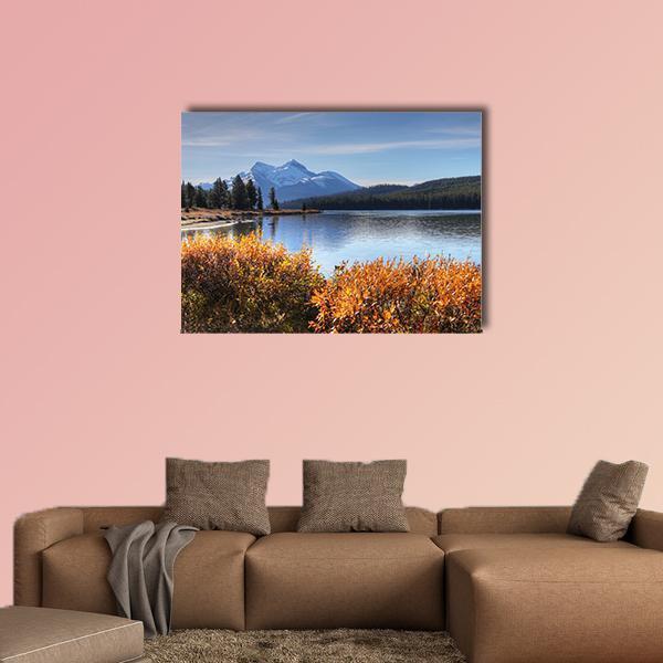 Maligne Lake, Rocky Mountains Canvas Wall Art in brown, orange and blue, single panel hung on a wall