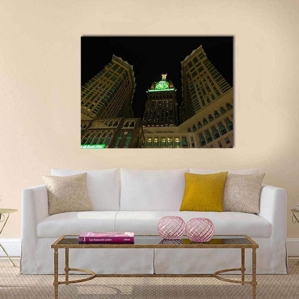 Makkah Royal Clock Tower at Night Canvas Wall Art in black, gold and green, single panel hung on a wall