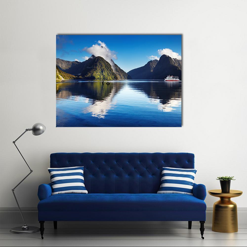 Red and White Boat at Milford Sound Canvas Wall Art in gray, green and blue, single panel hung on a wall