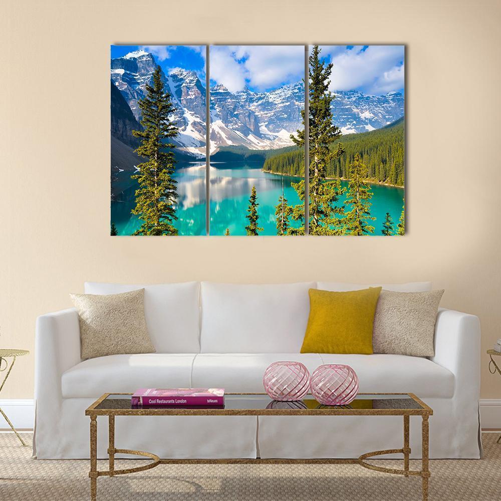 Moraine Lake with Snow-capped Mountains Canvas Wall Art in white, green and blue, 3 panel horizontal set hung on a wall