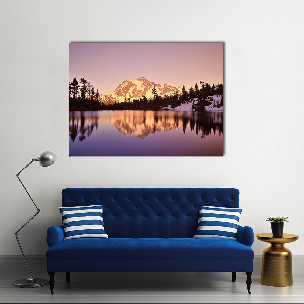 Mount Shuksan Lake Reflection Canvas Wall Art in orange, purple and pink, single panel hung on a wall