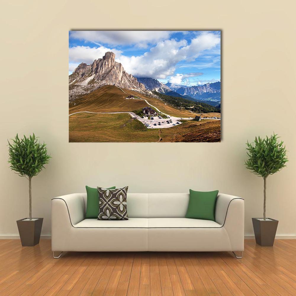 Snow-capped Mountain Road with Switchbacks Canvas Wall Art in white, brown and blue, single panel hung on a wall