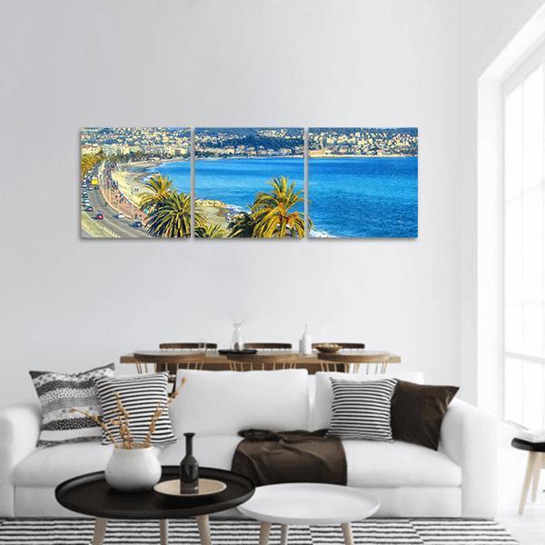 Mediterranean Coastal Cityscape with Palms Panoramic Canvas Wall Art in white, green and blue, hung on a wall