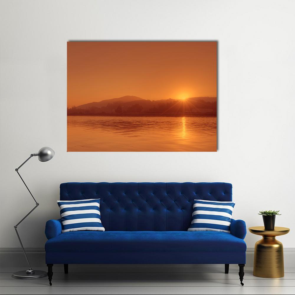 Nile River Sunset in Egypt Canvas Wall Art in orange and yellow, single panel hung on a wall