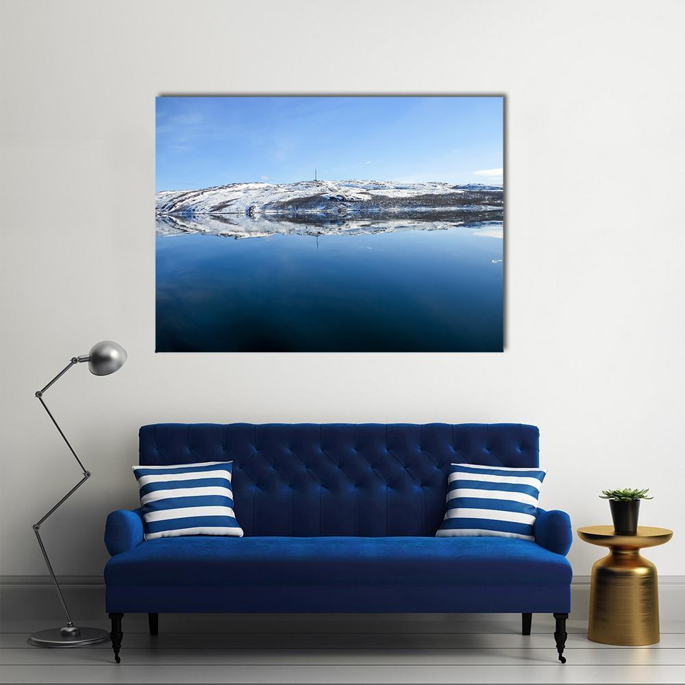 Snowy Mountain Lake in Norway Canvas Wall Art in white and blue, single panel hung on a wall