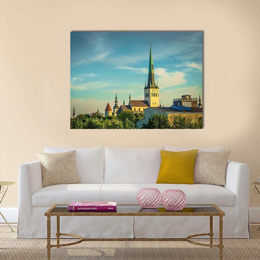 Tallinn Old Town Cityscape Canvas Wall Art in yellow, green and blue, single panel hung on a wall