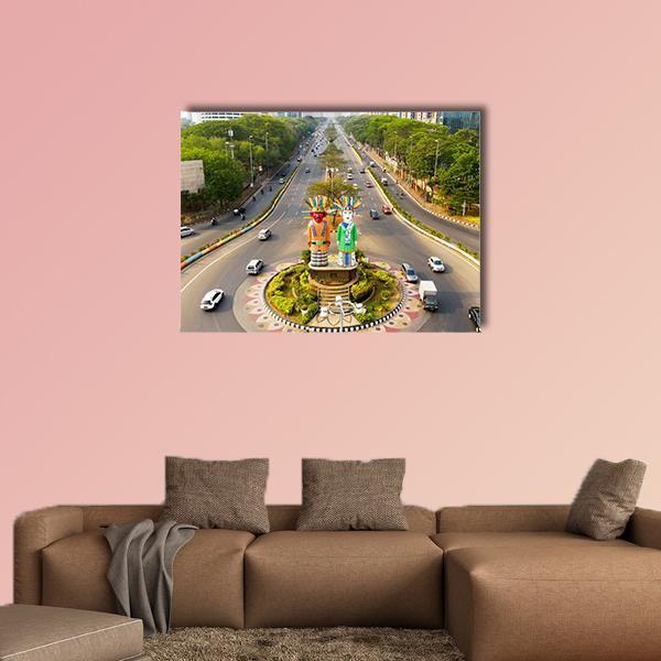Ondel-ondel Monument Roundabout View Canvas Wall Art in gray and green, single panel hung on a wall
