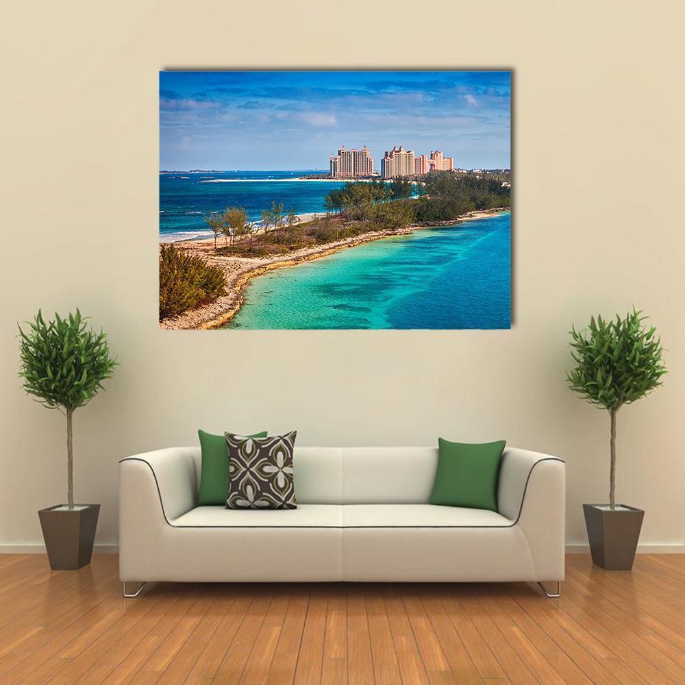 Paradise Island Over Turquoise Water Canvas Wall Art in green and blue, single panel hung on a wall
