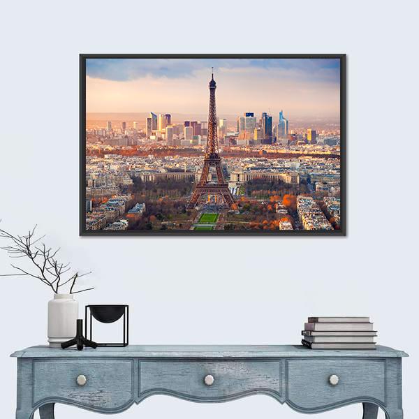 Eiffel Tower at Sunset Over Paris Canvas Wall Art in orange, yellow and blue, single panel hung on a wall