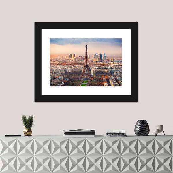 Eiffel Tower at Sunset Over Paris Canvas Wall Art in orange, yellow and blue, single panel hung on a wall
